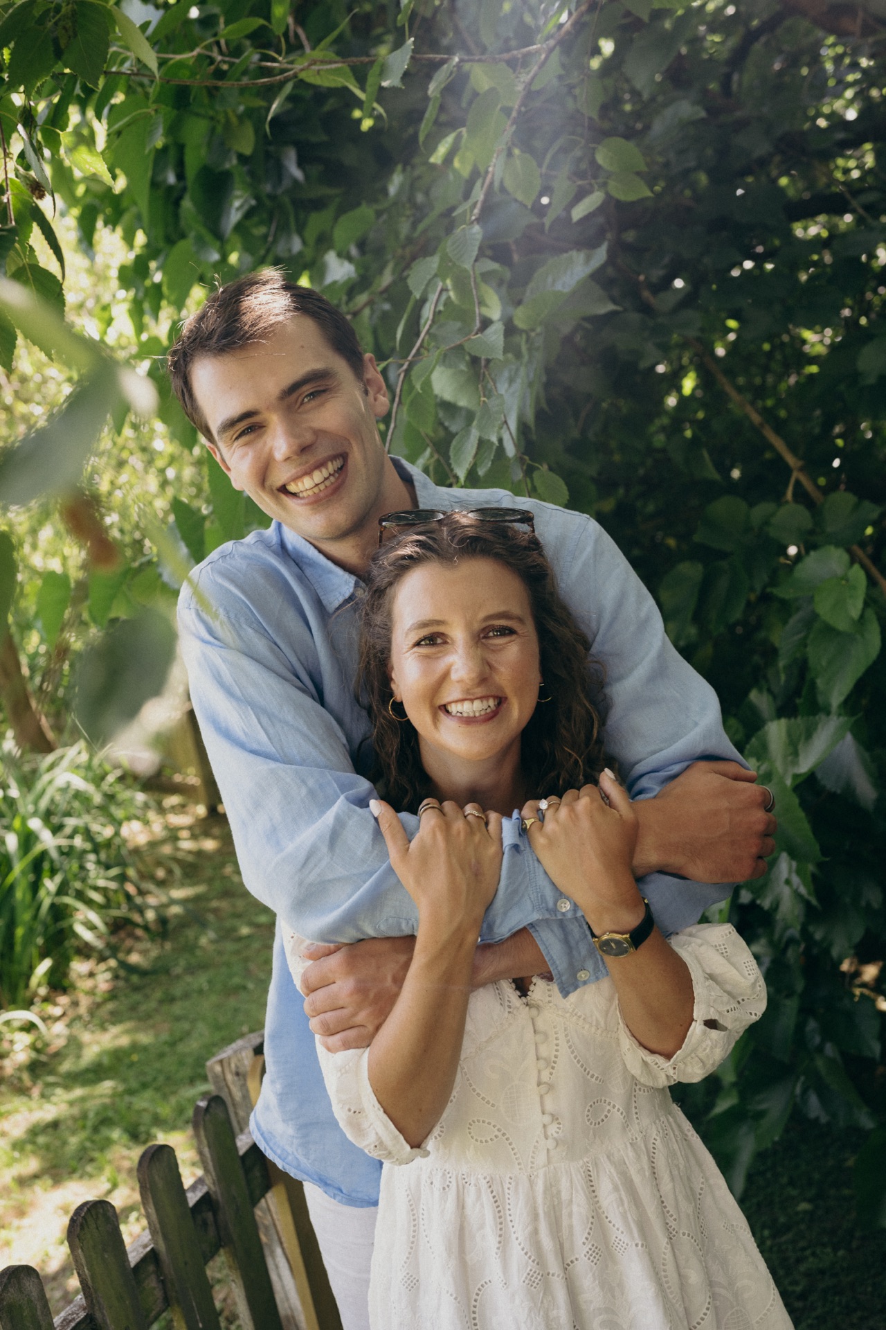 Vere with his arms around Ella in the garden