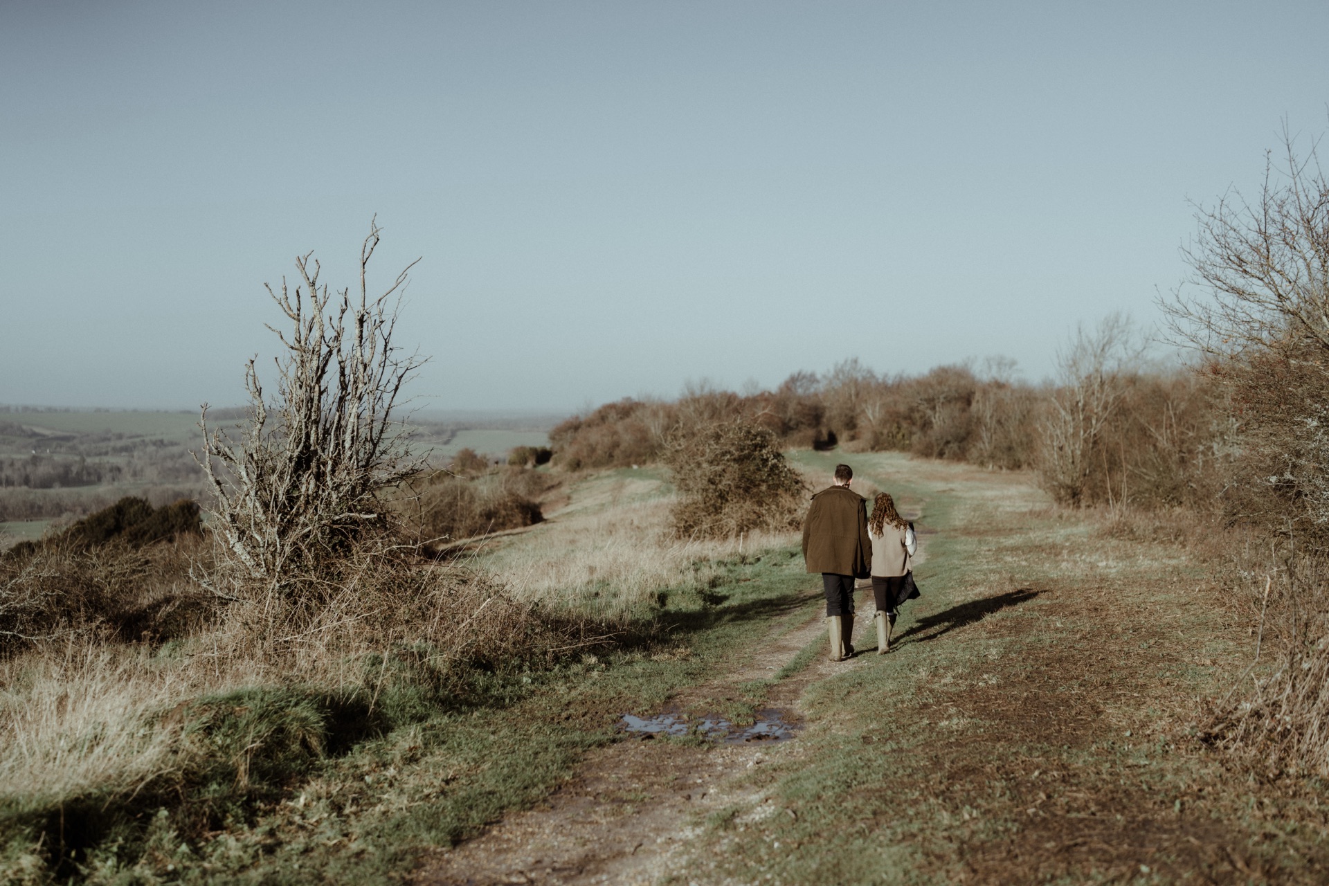 Ella and Vere walking away along a ridge path